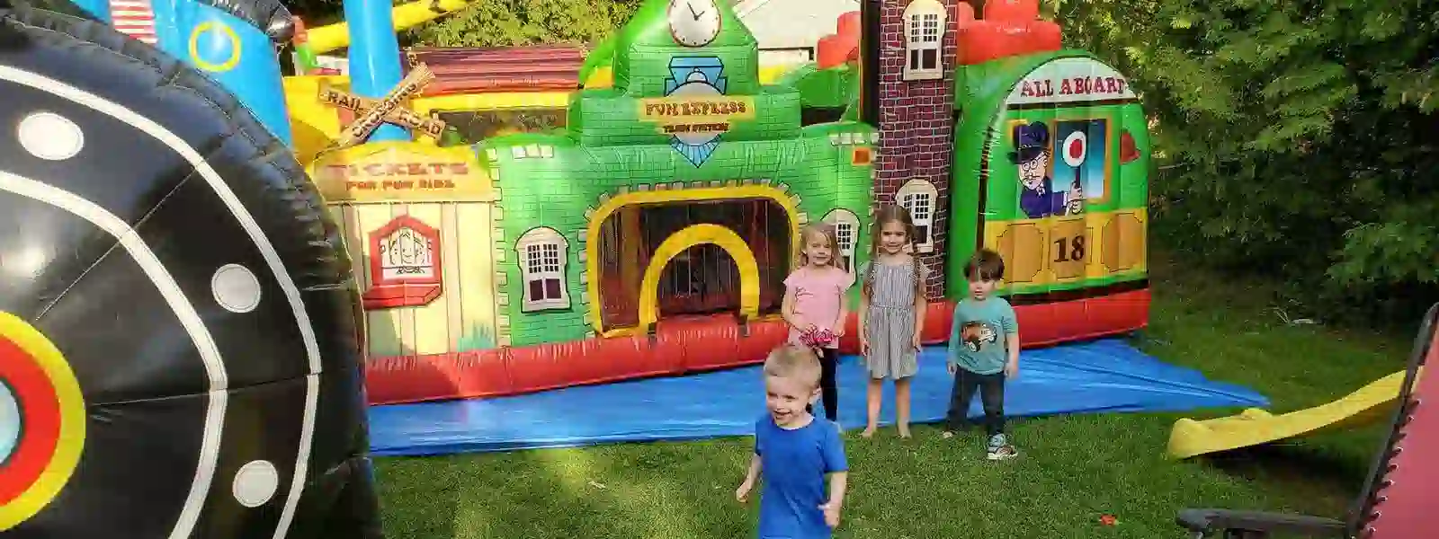 Toddlers playing in age-appropriate inflatable